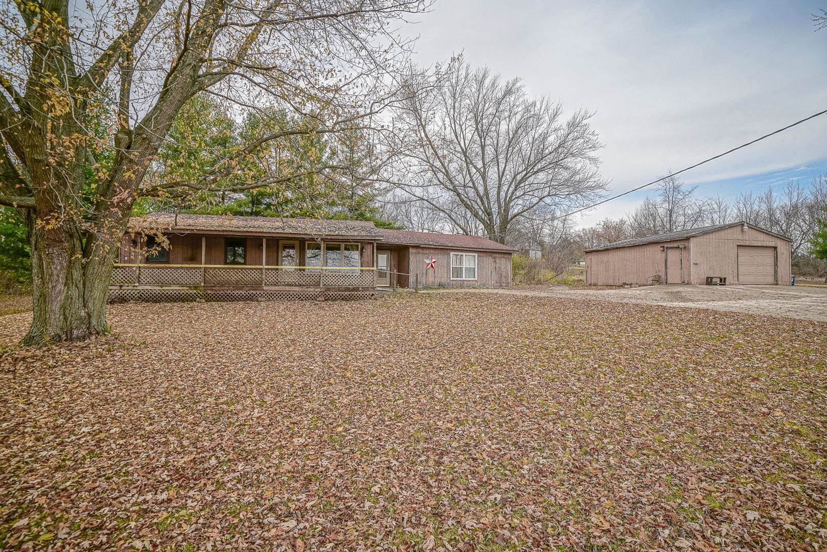 8330 North Kishwaukee Road Stillman Valley, IL 61084 - Photo 32 of 37 a front view of a house with a garden