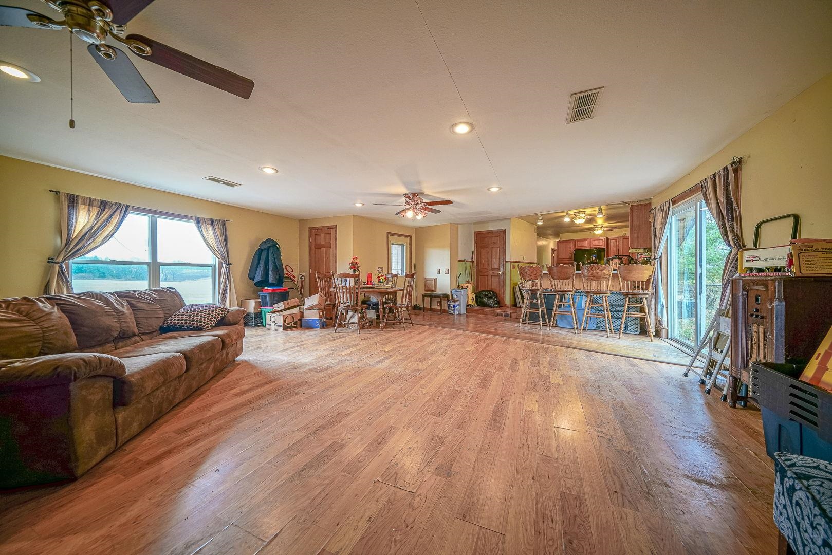 8330 North Kishwaukee Road Stillman Valley, IL 61084 - Photo 4 of 37 a living room with furniture and a flat screen tv