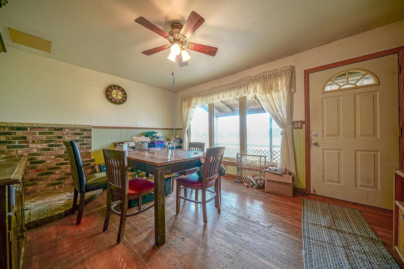 8330 North Kishwaukee Road Stillman Valley, IL 61084 - Photo 7 of 37 a view of a dining room with furniture window and wooden floor