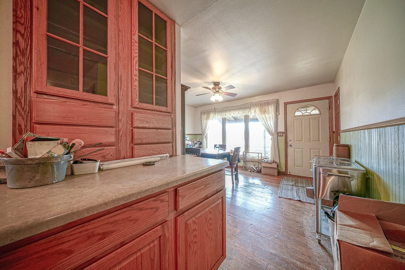 8330 North Kishwaukee Road Stillman Valley, IL 61084 - Photo 8 of 37 a living room with furniture and a large window