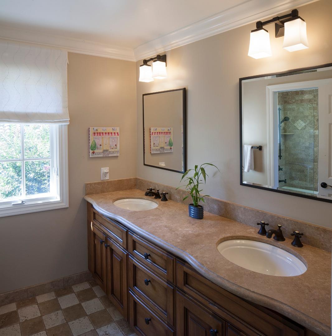 158 Seminary Drive Menlo Park, CA 94025 - Photo 19 of 23 a bathroom with a granite countertop sink a large mirror and a window