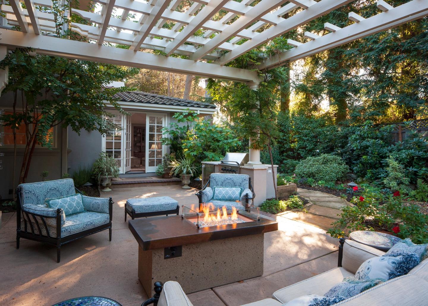 158 Seminary Drive Menlo Park, CA 94025 - Photo 20 of 23 a view of a patio with couches table and chairs and potted plants