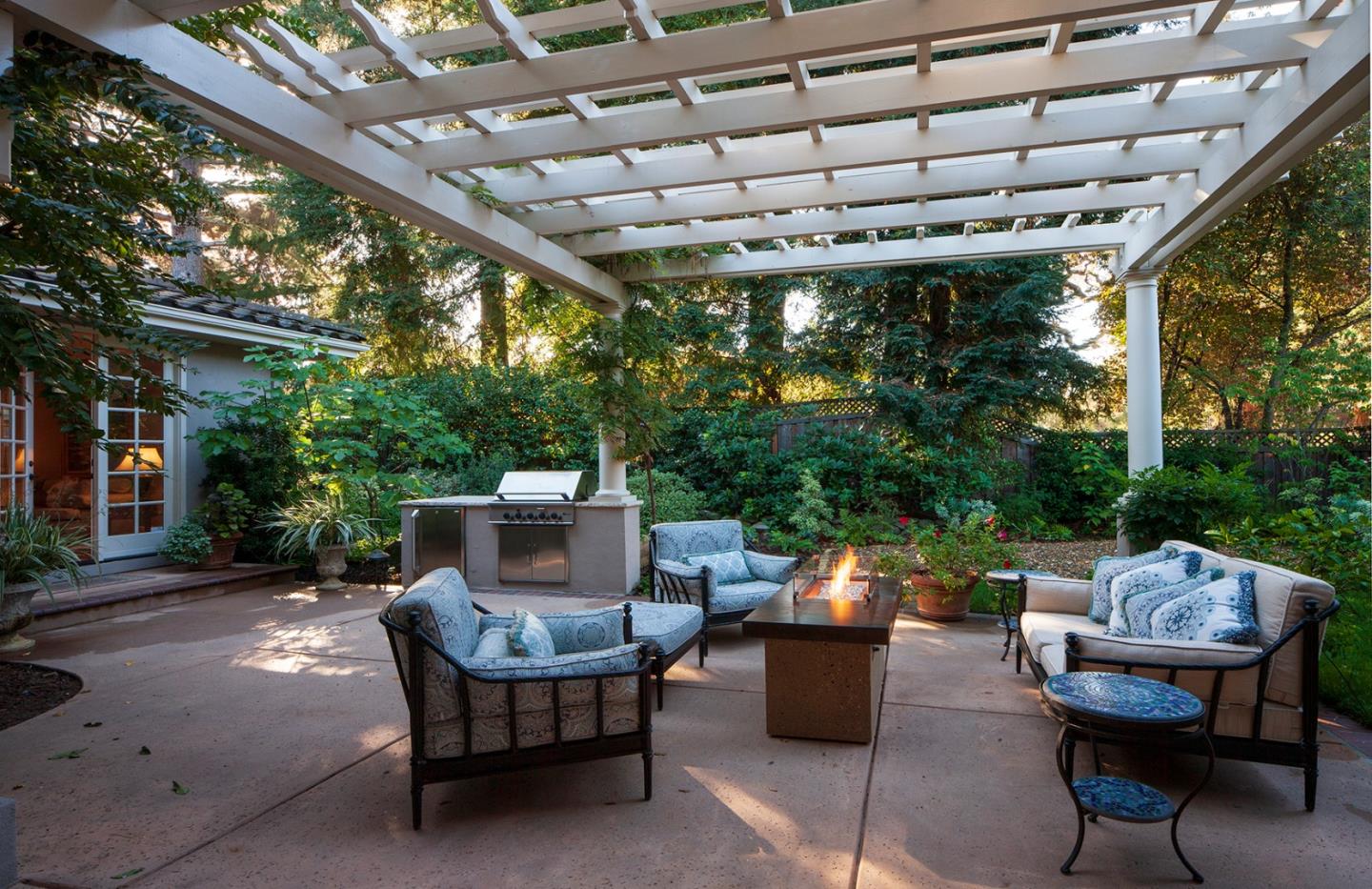 158 Seminary Drive Menlo Park, CA 94025 - Photo 21 of 23 a backyard of a house with fountain table and chairs