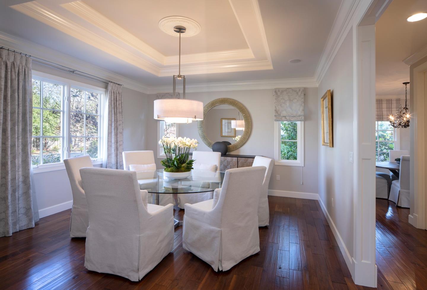 158 Seminary Drive Menlo Park, CA 94025 - Photo 5 of 23 a view of a dining room with furniture a potted plant and wooden floor