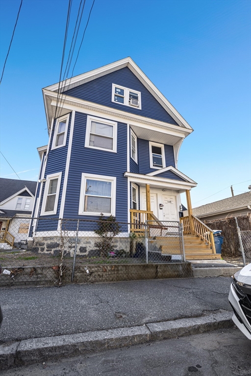 139-141 Foster Street Lawrence, MA 01843 - Photo 1 of 16 a front view of a house with a yard