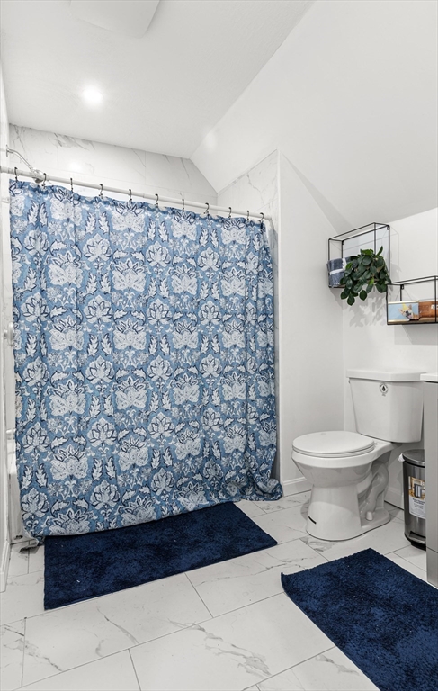 139-141 Foster Street Lawrence, MA 01843 - Photo 12 of 16 a bathroom with a toilet and a shower