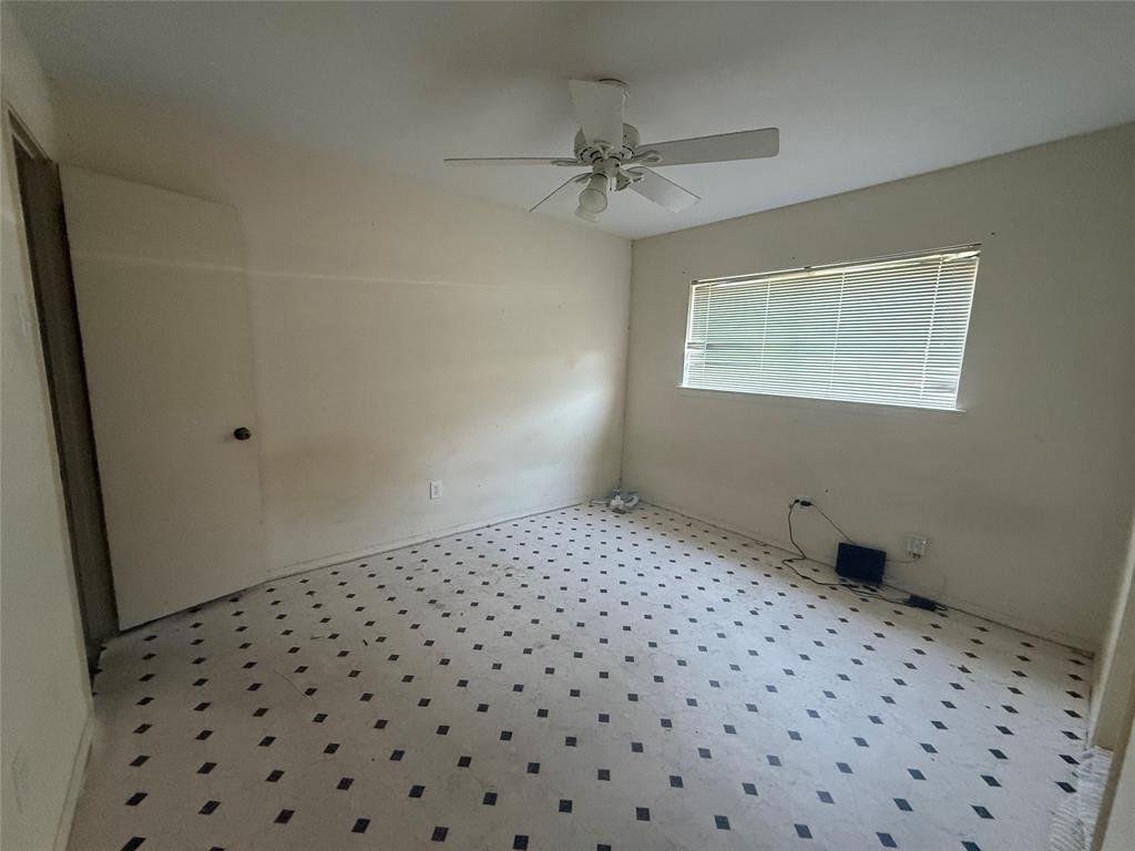 13329 Southview Lane Dallas, TX 75240 - Photo 11 of 17 a bedroom with a bed and a window