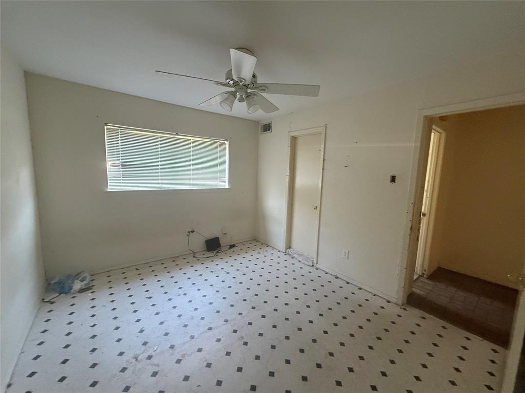 13329 Southview Lane Dallas, TX 75240 - Photo 12 of 17 a bedroom with a bed and a dresser