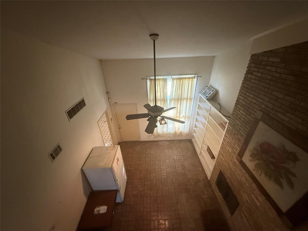 13329 Southview Lane Dallas, TX 75240 - Photo 13 of 17 a living room with furniture and a chandelier