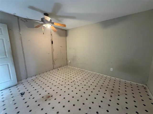 a bedroom with a bed and a mirror