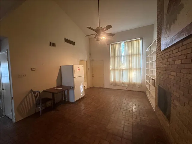 a view of a livingroom with furniture and windows