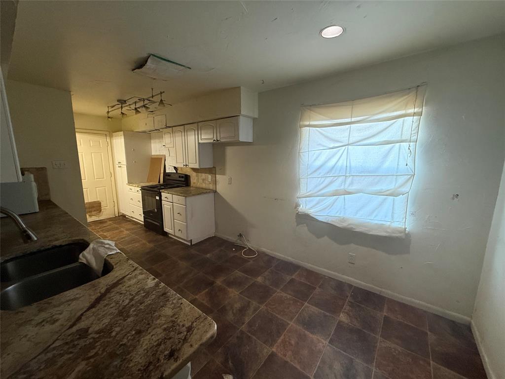 13329 Southview Lane Dallas, TX 75240 - Photo 9 of 17 a kitchen with a sink appliances and cabinets