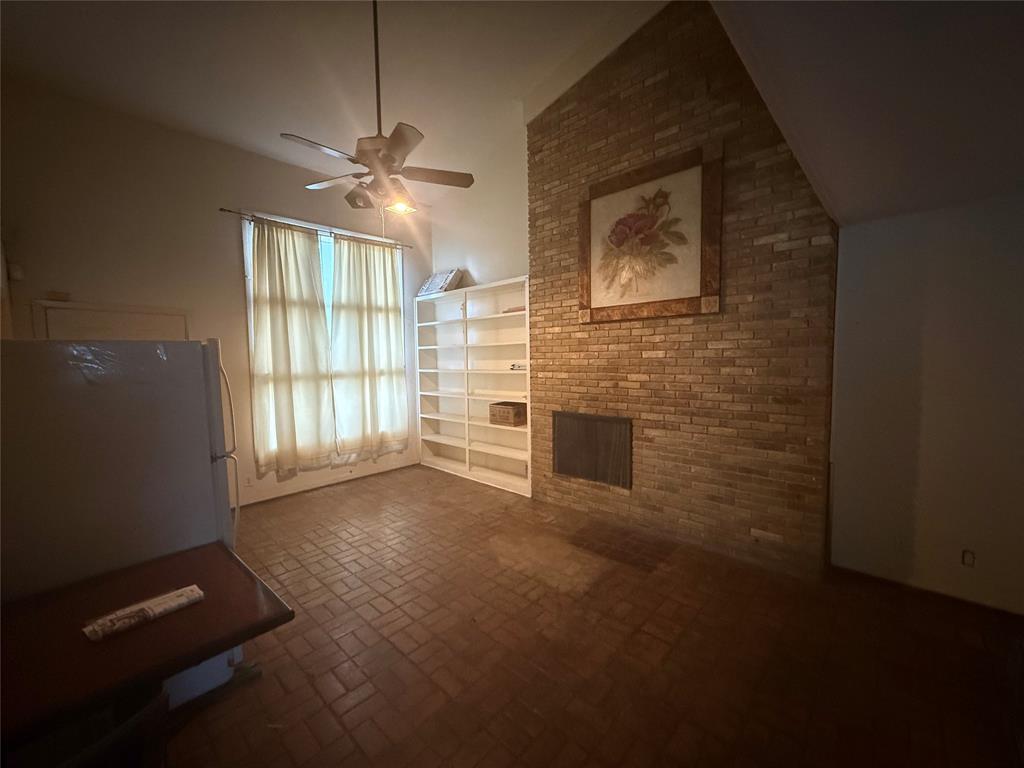 13329 Southview Lane Dallas, TX 75240 - Photo 10 of 17 a view of a livingroom with a ceiling fan and window