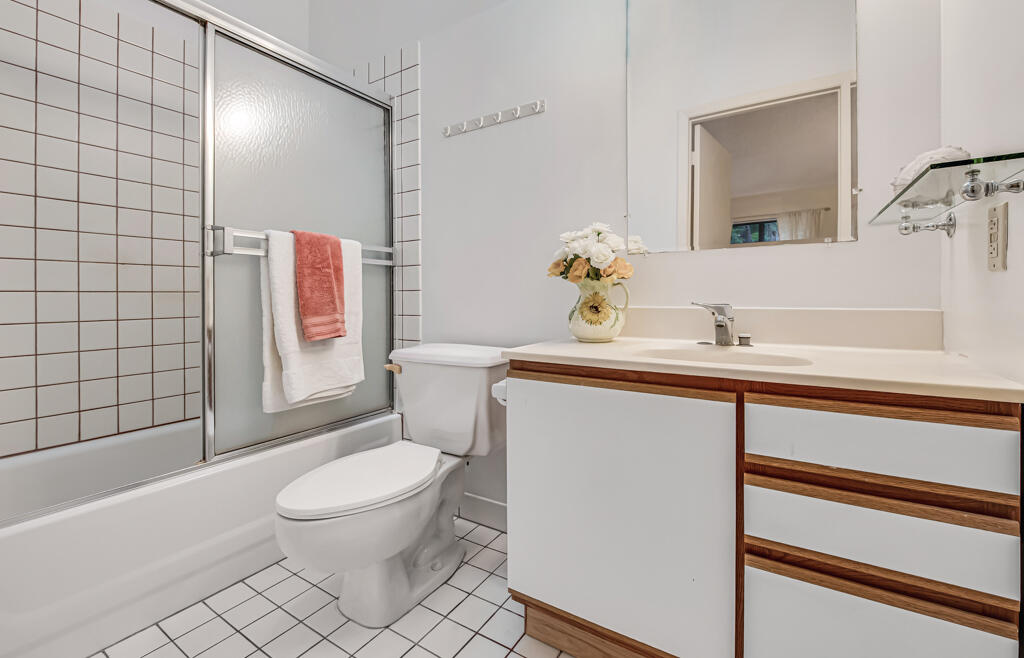 815 Andrew Redding Road, Unit 202 Lantana, FL 33462 - Photo 19 of 30 a white toilet sitting next to a bathroom sink