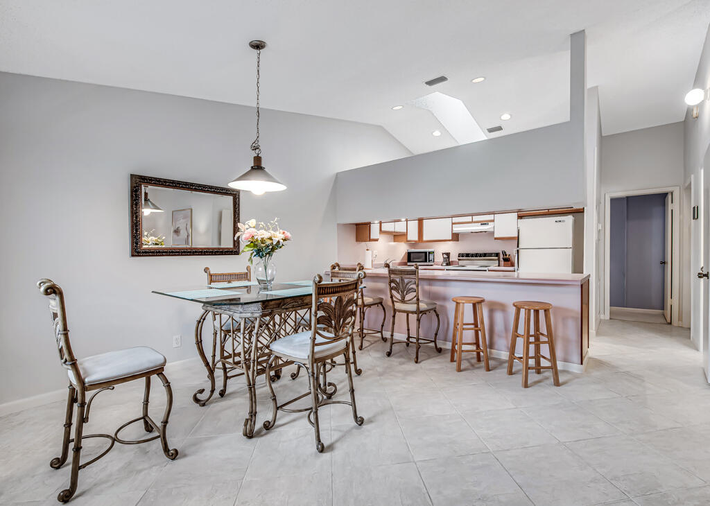 815 Andrew Redding Road, Unit 202 Lantana, FL 33462 - Photo 2 of 30 a view of a dining room with furniture