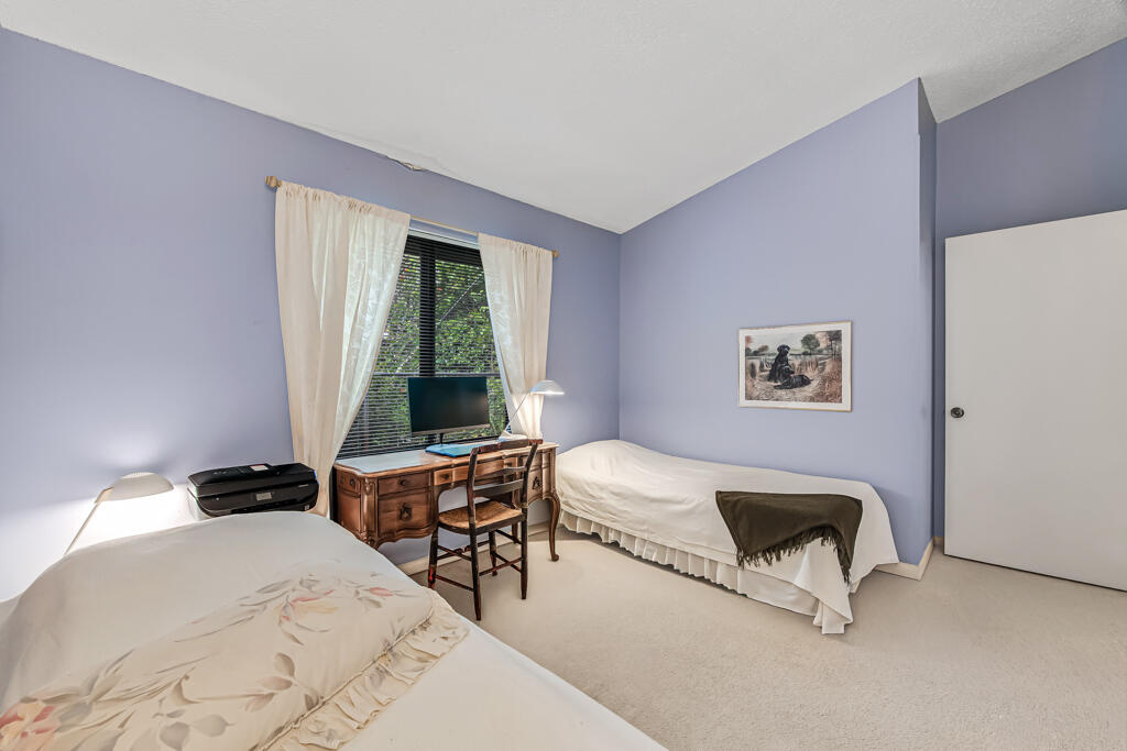 815 Andrew Redding Road, Unit 202 Lantana, FL 33462 - Photo 21 of 30 a bedroom with a bed and a window