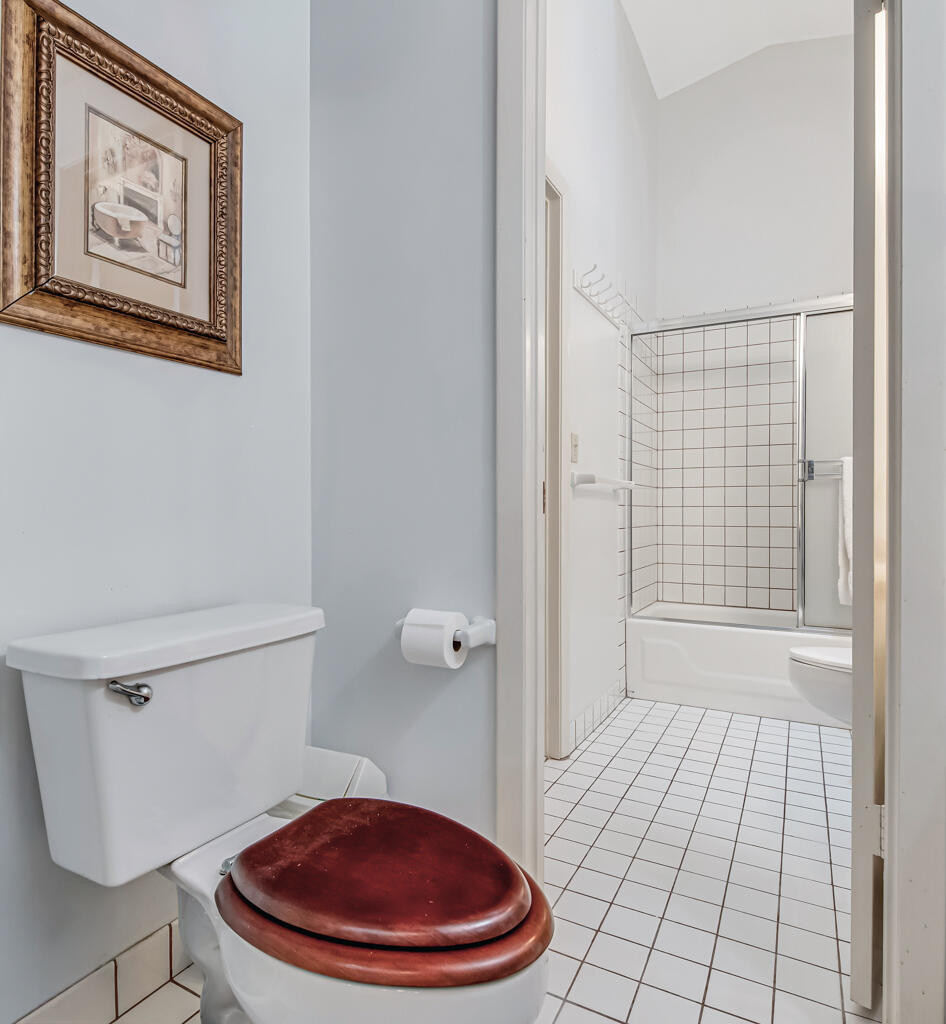 815 Andrew Redding Road, Unit 202 Lantana, FL 33462 - Photo 23 of 30 a bathroom with a toilet and a shower
