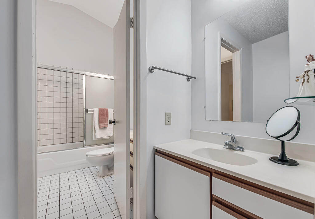 815 Andrew Redding Road, Unit 202 Lantana, FL 33462 - Photo 25 of 30 a bathroom with a sink toilet and shower