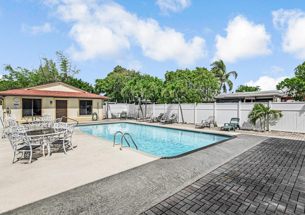815 Andrew Redding Road, Unit 202 Lantana, FL 33462 - Photo 26 of 30 a view of house with swimming pool and furniture