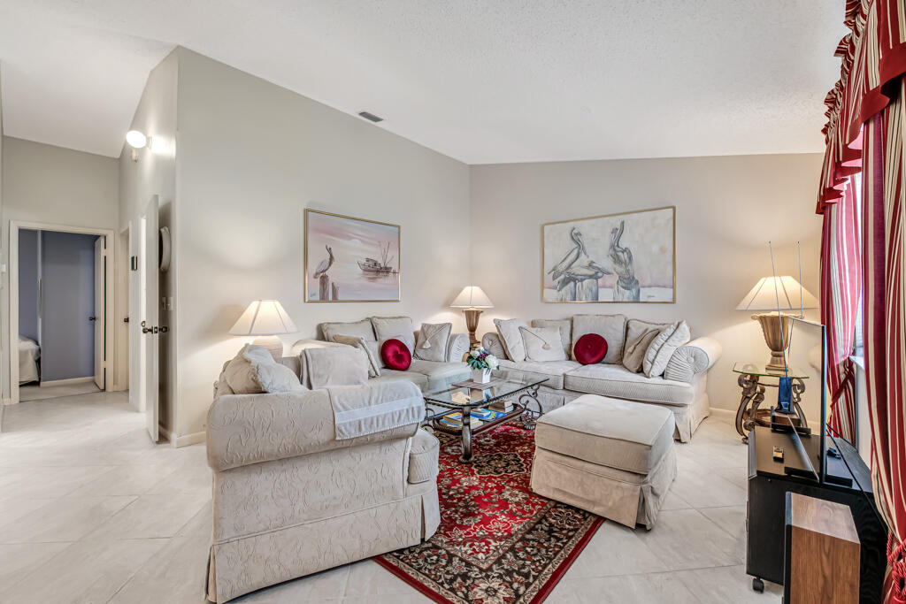 815 Andrew Redding Road, Unit 202 Lantana, FL 33462 - Photo 5 of 30 a living room with furniture and a couch
