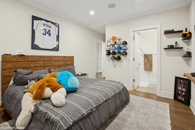 a bedroom with a bed and a view of bathroom