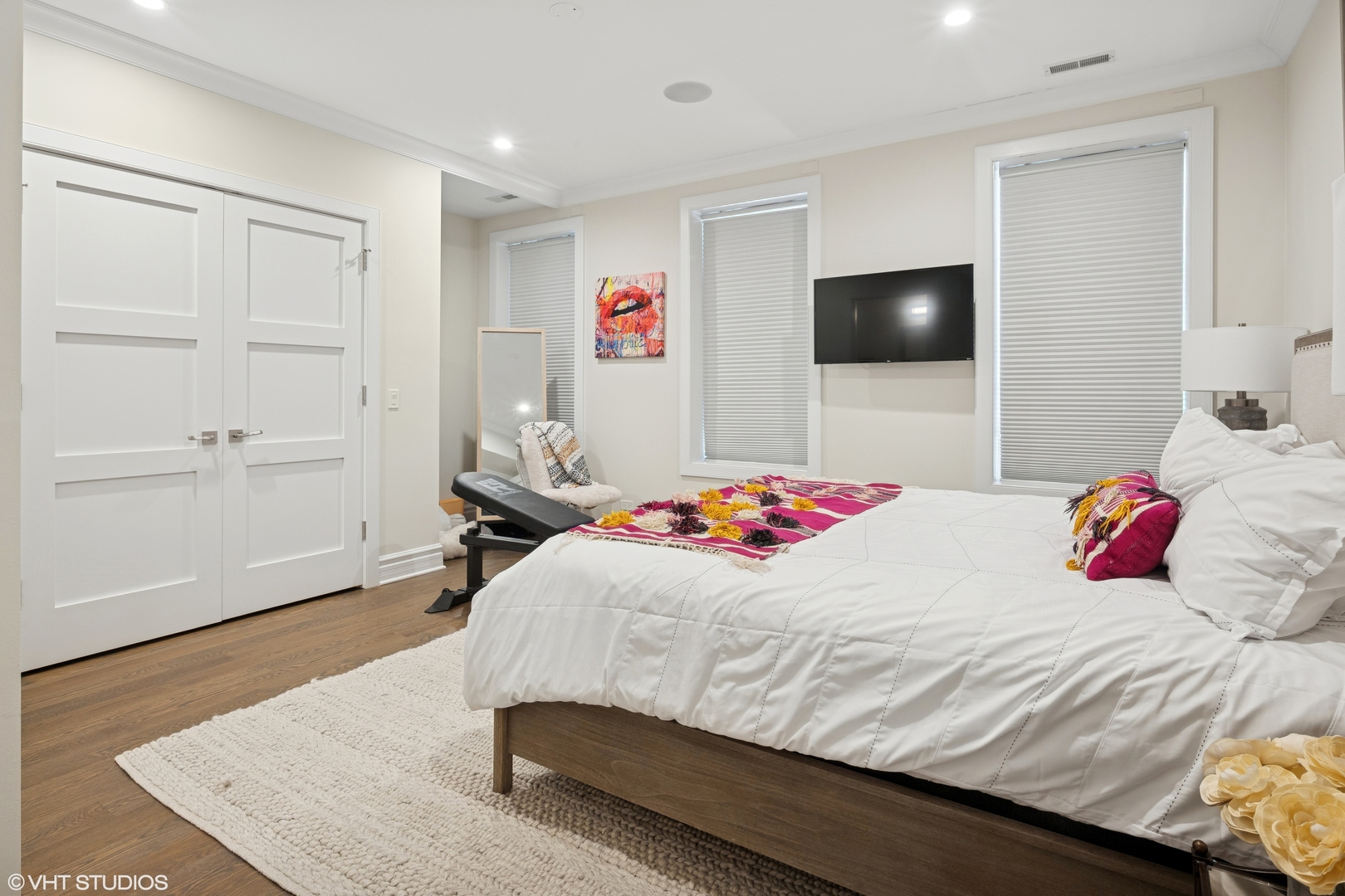 1851 North Halsted Street, Unit 2 Chicago, IL 60614 - Photo 24 of 31 a bedroom with a bed and a flat screen tv