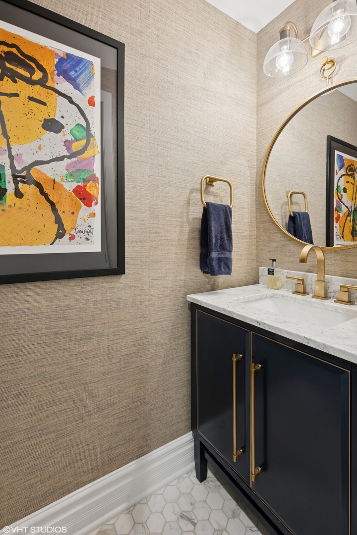 1851 North Halsted Street, Unit 2 Chicago, IL 60614 - Photo 26 of 31 a bathroom with a sink and a mirror