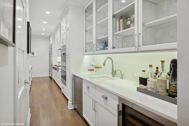 a kitchen with cabinets and window