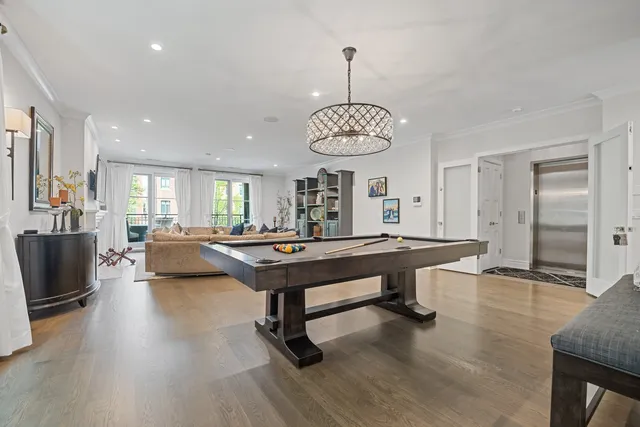 a living room with dining table a couches and kitchen view