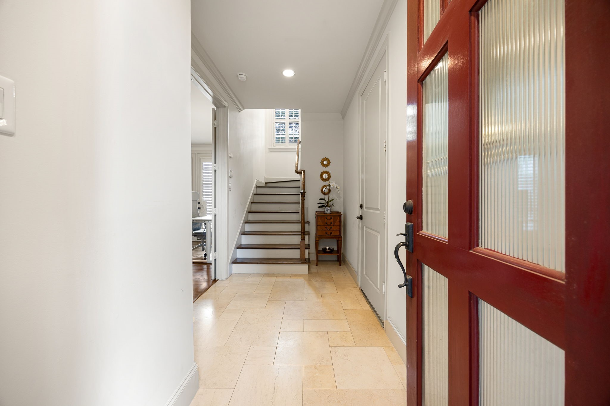 310 West Bell Street Houston, TX 77019 - Photo 5 of 44 Upon entering the home, you will notice one of the secondary bedrooms and the garage entry. The space is light and open and the staircase leads you to the main living floor.