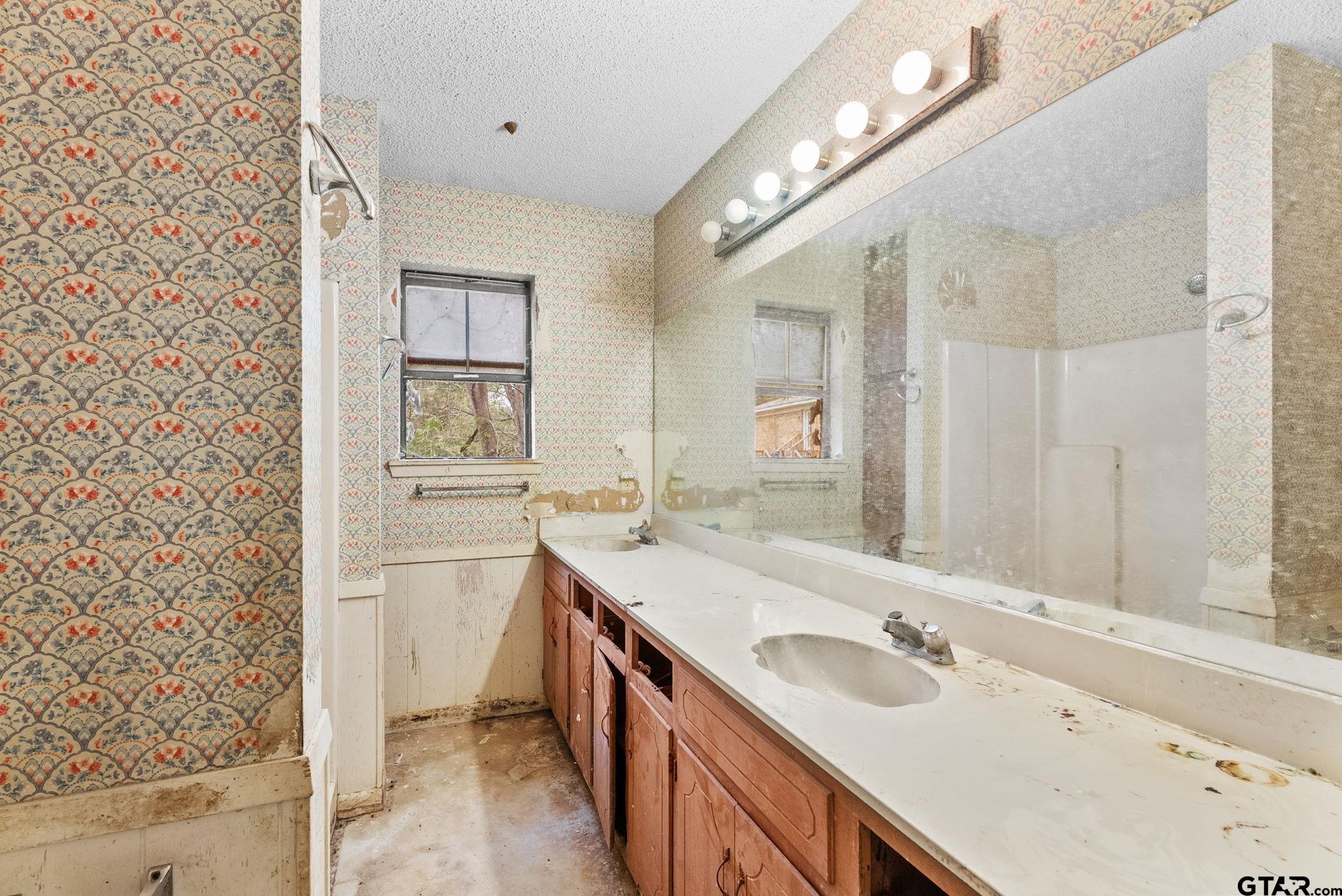 21135 County Road 1291 Flint, TX 75762 - Photo 22 of 25 a bathroom with a sink and a mirror