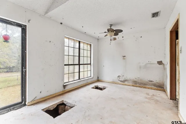 a view of a bathroom with a sink and a shower