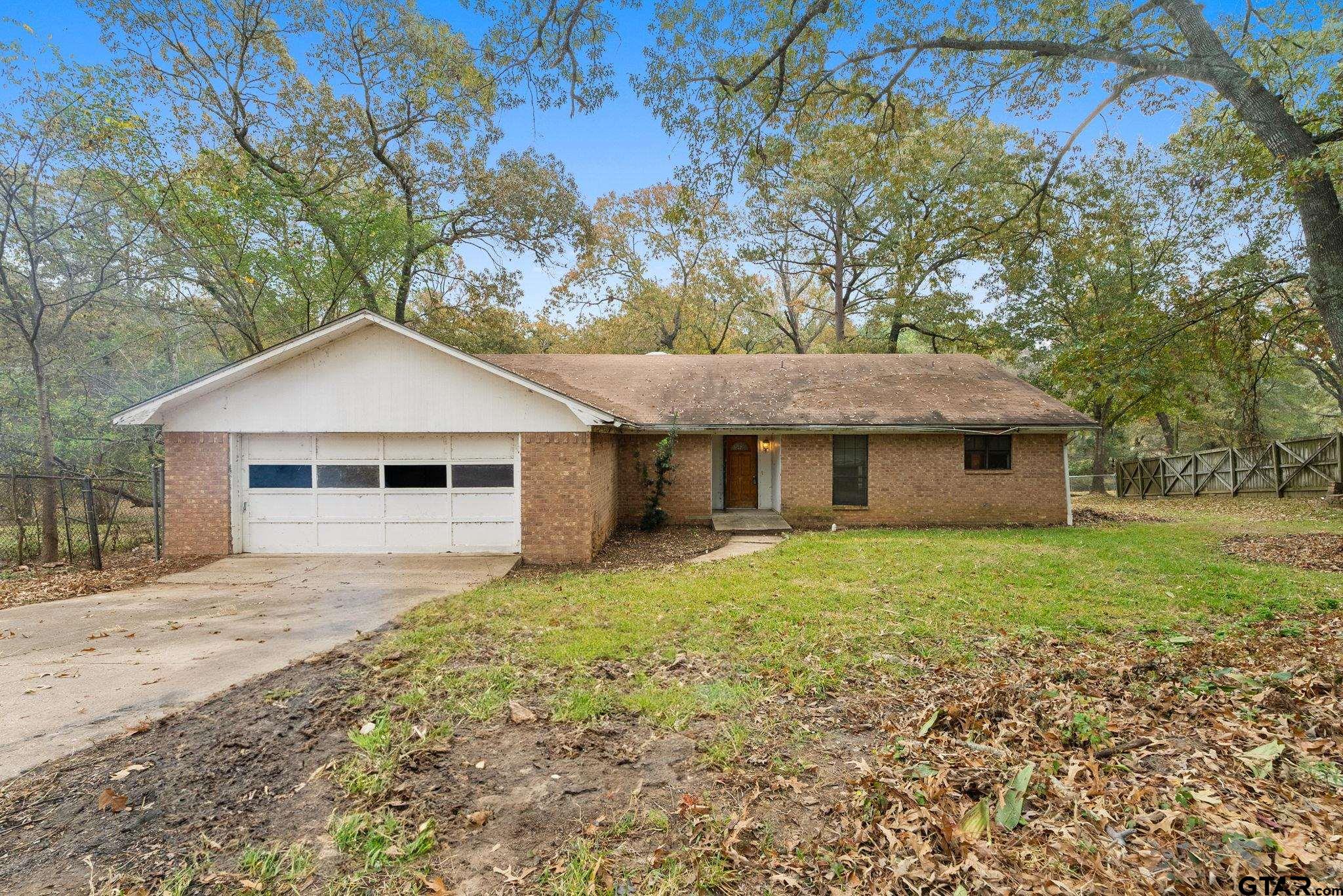21135 County Road 1291 Flint, TX 75762 - Photo 10 of 25 a front view of a house with yard and trees