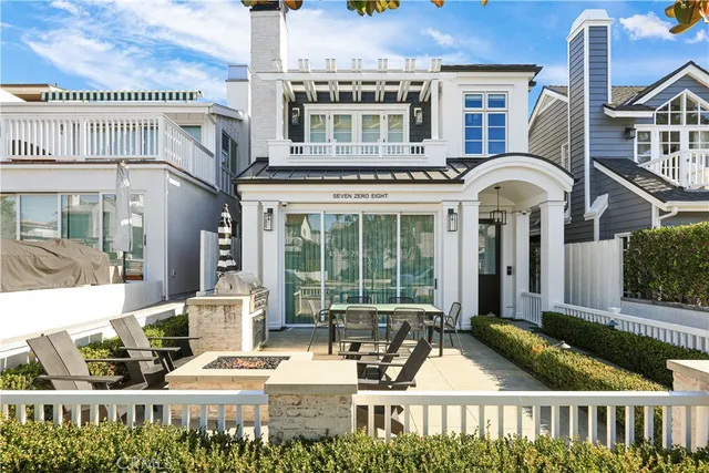 a front view of a building with porch and patio
