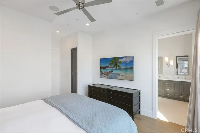 a bedroom with a bed and glass wall