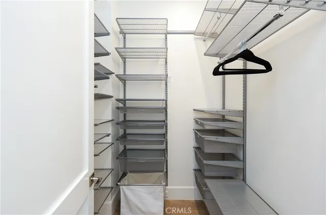 a view of a store room with racks on the wall