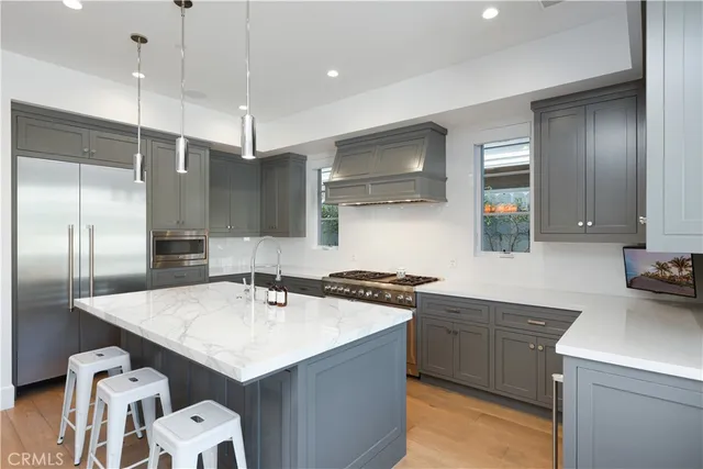 a large kitchen with a table and chairs