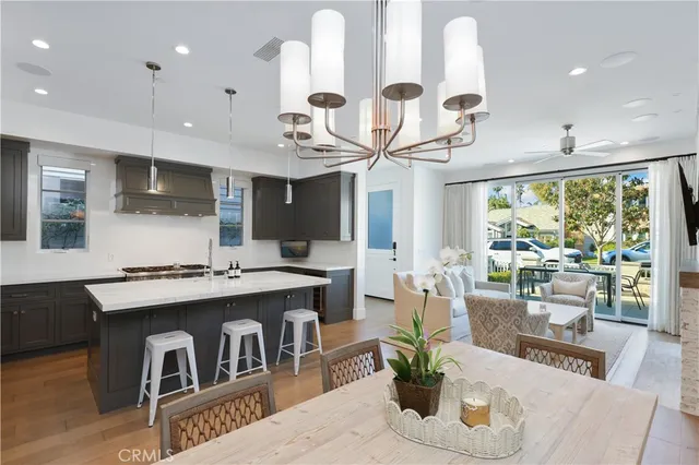a kitchen with a table and chairs