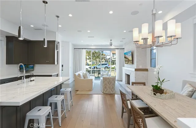 a large kitchen with a table and chairs