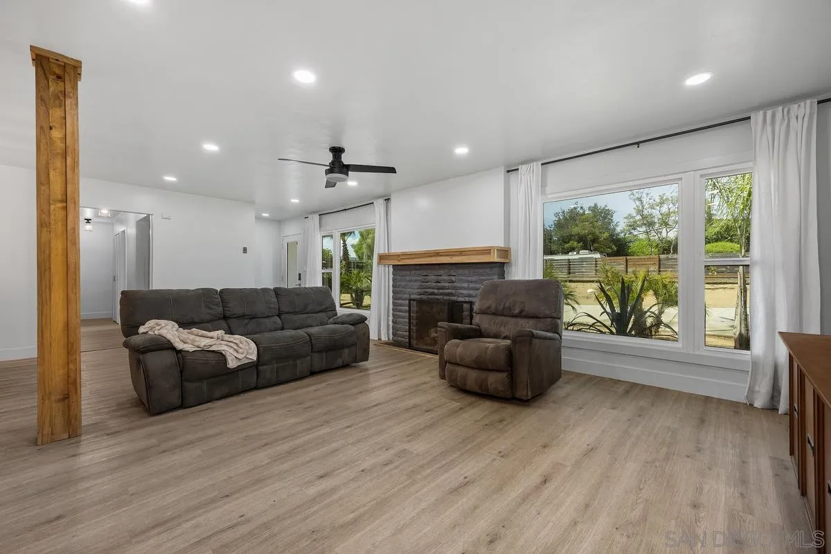 1211 East Mission Road Fallbrook, CA 92028 - Photo 7 of 31 a living room with furniture and a fireplace