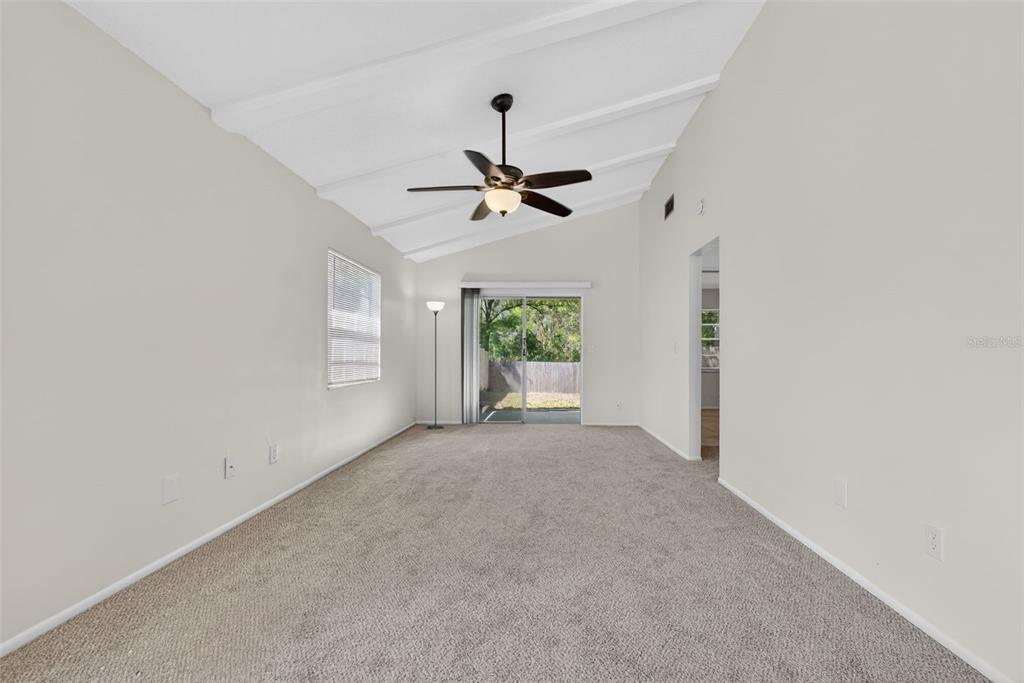 4915 Billy Direct Lane Lutz, FL 33559 - Photo 23 of 73 a view of a livingroom with a window and a ceiling fan