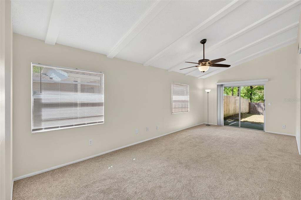 4915 Billy Direct Lane Lutz, FL 33559 - Photo 27 of 73 a view of a livingroom with a ceiling fan and window