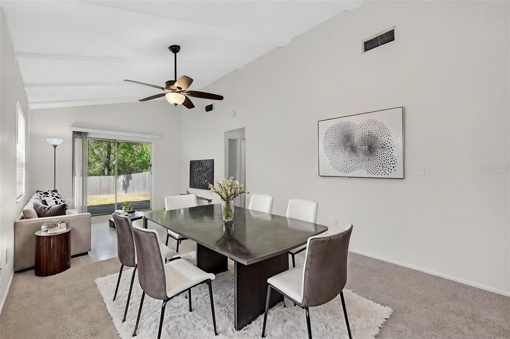 4915 Billy Direct Lane Lutz, FL 33559 - Photo 31 of 73 a view of a dining room with furniture window and wooden floor