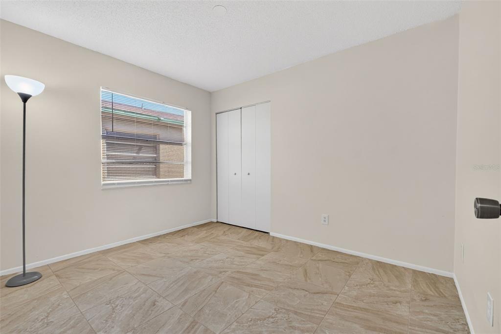 4915 Billy Direct Lane Lutz, FL 33559 - Photo 32 of 73 a view of an empty room with a window