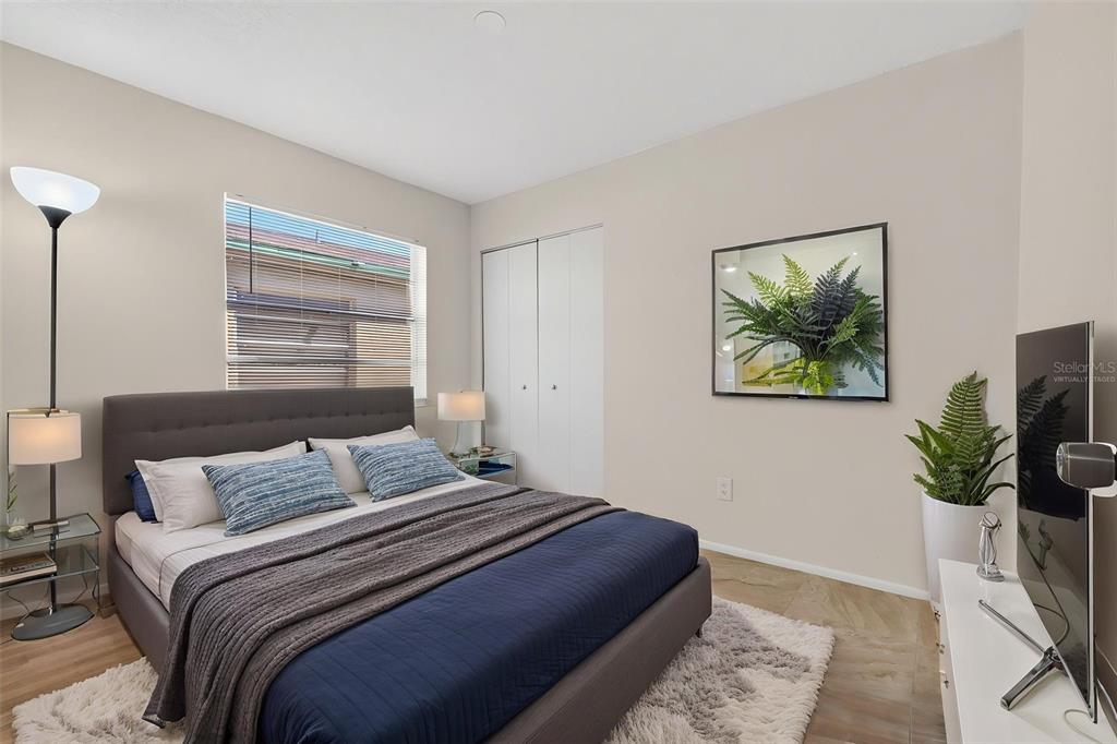 4915 Billy Direct Lane Lutz, FL 33559 - Photo 33 of 73 a bedroom with a bed and a painting on the wall