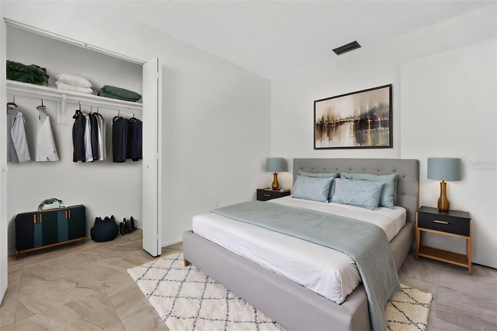 4915 Billy Direct Lane Lutz, FL 33559 - Photo 38 of 73 a bedroom with a bed and a walk in closet