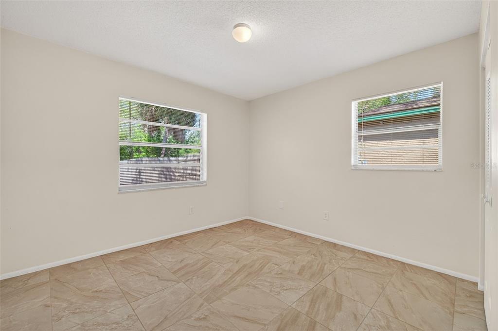 4915 Billy Direct Lane Lutz, FL 33559 - Photo 40 of 73 an empty room with windows