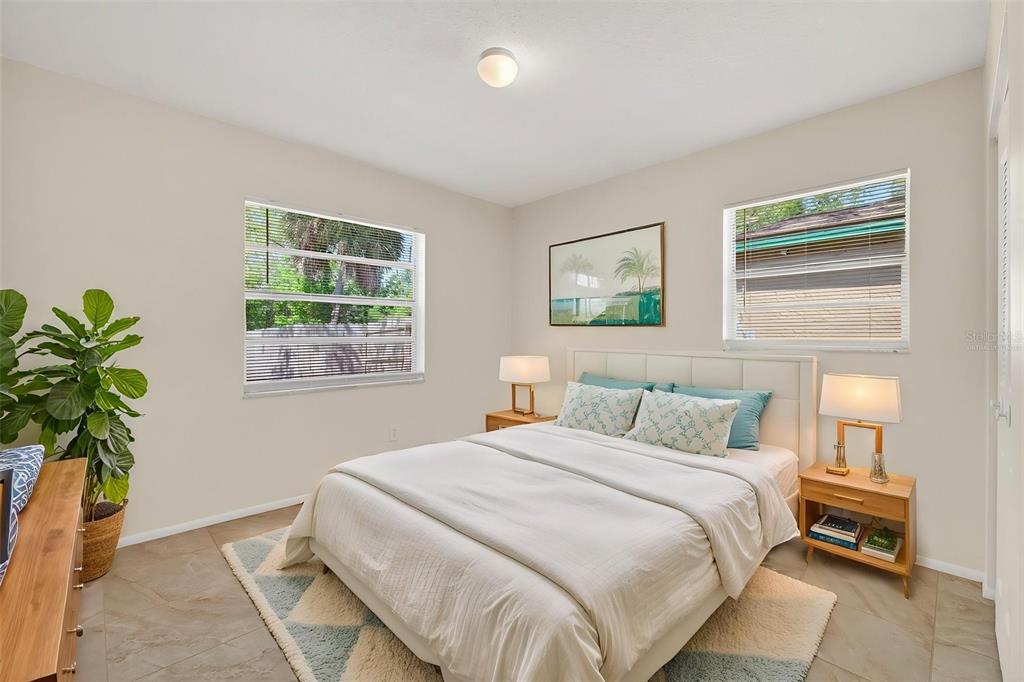 4915 Billy Direct Lane Lutz, FL 33559 - Photo 41 of 73 a bedroom with a bed and a potted plant