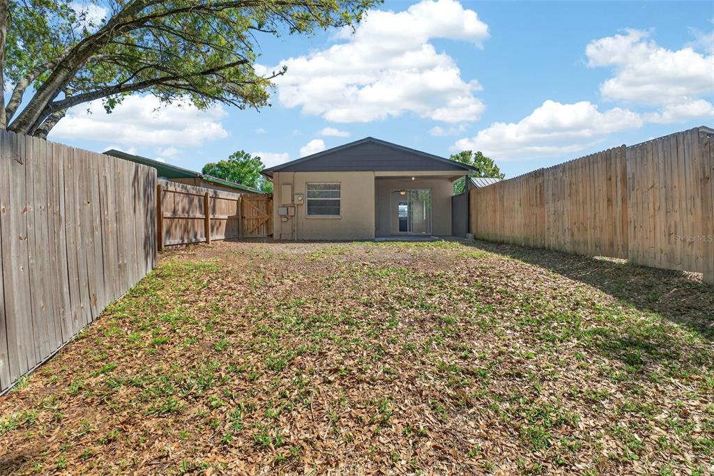 4915 Billy Direct Lane Lutz, FL 33559 - Photo 52 of 73 a front view of a house with a yard and garage