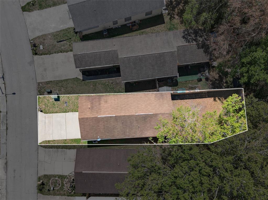 4915 Billy Direct Lane Lutz, FL 33559 - Photo 59 of 73 an aerial view of a house with a yard